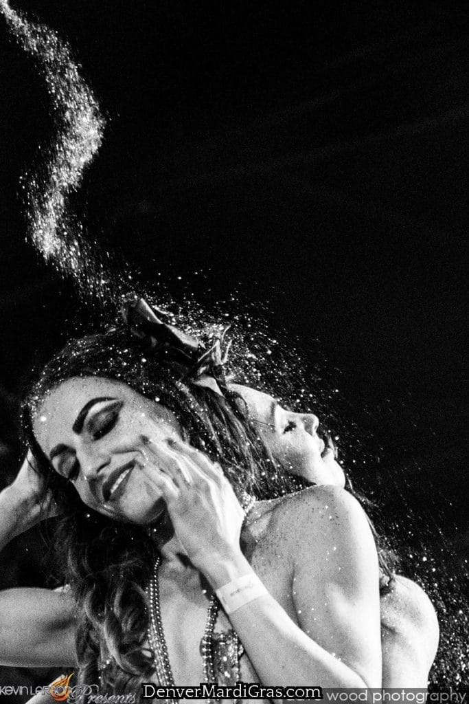 Mardi Gras celebration dancers joyfully performing Denver